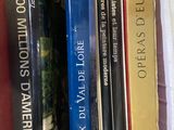 many books that are on a shelf together