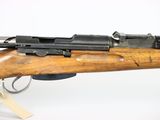 a close up of a rifle on a white background with a tag