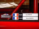 a picture of a car with stickers on the side of it