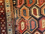 an image of a large rug with many different colors and patterns