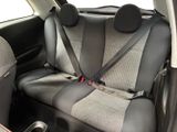 two seats in the back of a small car