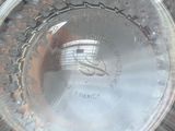a glass plate with a clock on it on a table