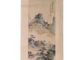 an oriental painting hanging on the wall of a room