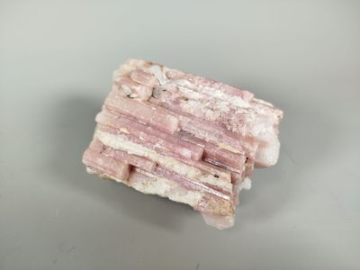 a piece of pink rock that is on a table
