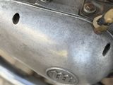 a close up of a motorcycle engine with a small hole in it