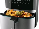an image of a digital air fryer with vegetables in it