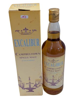 an image of an empty bottle of whisky next to a box