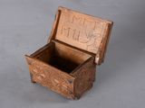 a small wooden box that has writing on it