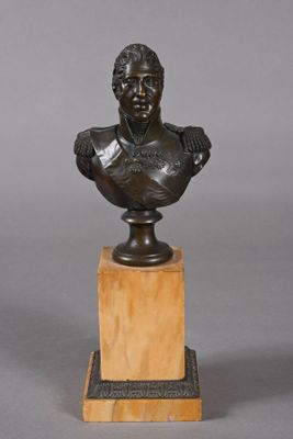 bronze bust of a man on a marble base