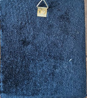 a close up of a piece of denim with a padlock on it