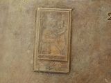 a picture of a wall with a plaque on it