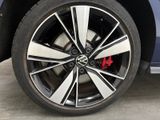 a close up of a tire on a blue car