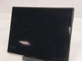 an image of a monitor on a stand on a table