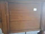 a wooden table with a drawer on top of it