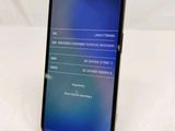 the back of a phone with a display on it on a white surface