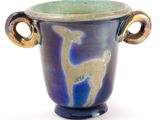 a blue and green vase with a deer on it