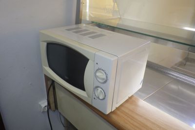 a white microwave sitting on top of a counter
