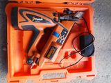 an orange tool box with tools in it on the floor