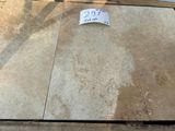 a lot of tile on the ground with a price tag on it