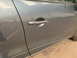 a car door handle on the side of the car