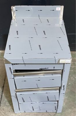 a stack of boxes sitting on top of each other on the floor