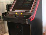 an old style video game machine in the corner of a living room