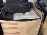 several suitcases are stacked on top of a cart in a storage room