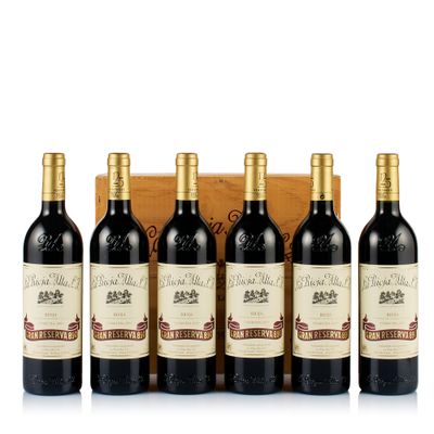 six bottles of red wine in a wooden box