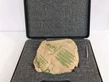 a black case with a piece of paper in it