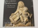 the cover of a book with a statue of a woman holding a child