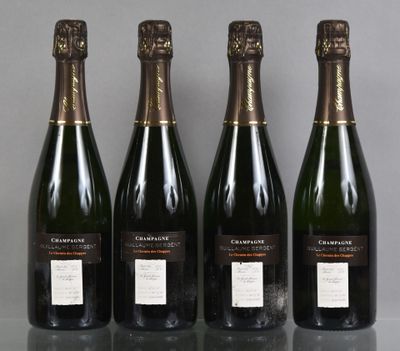 three bottles of champagne sitting on a table next to each other