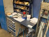 an image of a workbench with a lot of tools on it