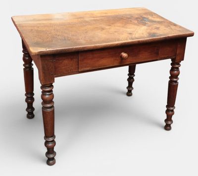an old wooden table with a drawer on top of it