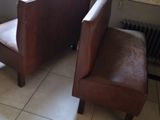 two chairs and a table in a small room