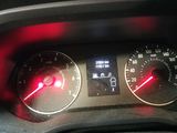 a close up of a car dashboard with a speedometer and gauges