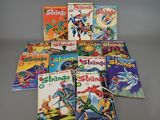 many children ' s comics are arranged in a pile on a table