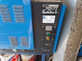 a blue machine that is sitting on a table
