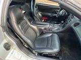 the interior of a car with black leather seats and a steering wheel