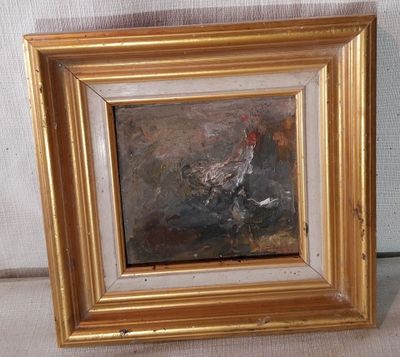 une photo d'un tableau représentant un coq, dans un cadre doré