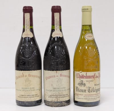 three bottles of wine sitting next to each other on a table