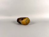 an image of a small piece of food on a white surface