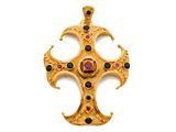 une image représentant une croix en or ornée de pierres noires et rouges