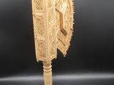an image of a wooden sculpture of a bird on a pedestal