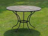 a table that is sitting on the grass in the yard