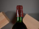 a bottle of wine that is sitting on a table