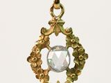 an image of a close up of a pendant on a string