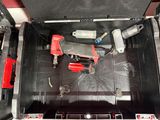 an overhead view of a tool box with tools inside of it