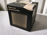 a small black radio sitting on top of a white table