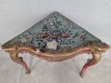 an image of a small table with a floral design on top of it