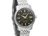 seiko men ' s automatic watch with black dial and gold accents